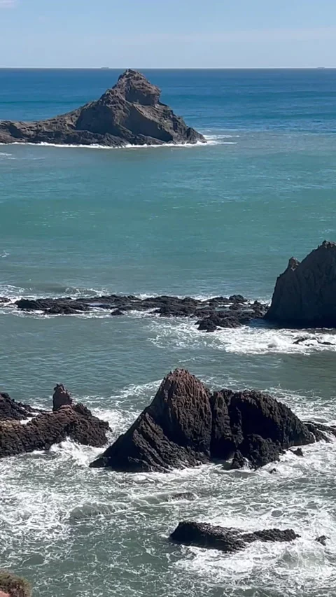 Vertical video of a sea with waves over the rocks Stock Footage 266063325