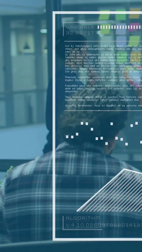 Vertical video: Seated dev using screen causing tech UI animating algorithm Stock-Footage 331181817