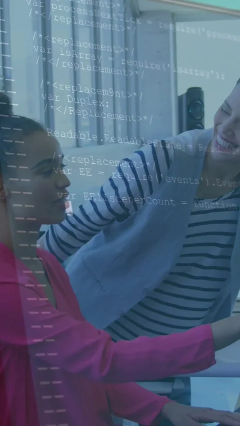 Vertical video: Seated IT dev typing after colleague pointing at screen, code Stock Footage 334391406