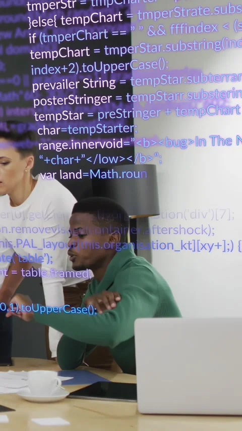 Vertical video: Seated man reaching laptop, woman guiding tech review, code Stock Footage 334390698