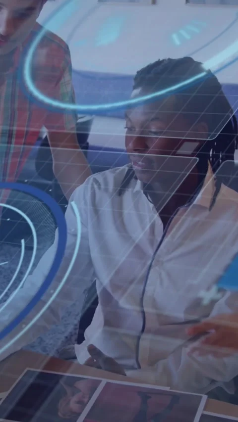 Vertical video: Seated man responding to peer pointing, using tablet to control Stock Footage 330196069