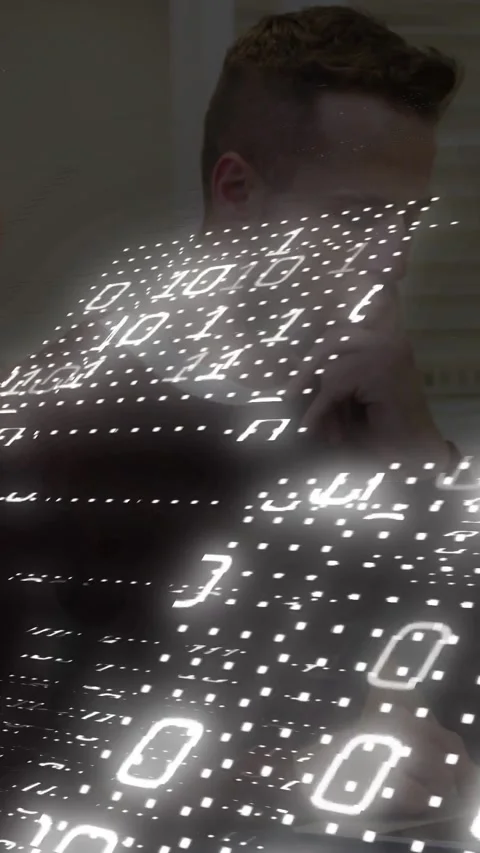 Vertical video: Seated man shifting chin to typing as data dots appearing on Stock Footage 331167364