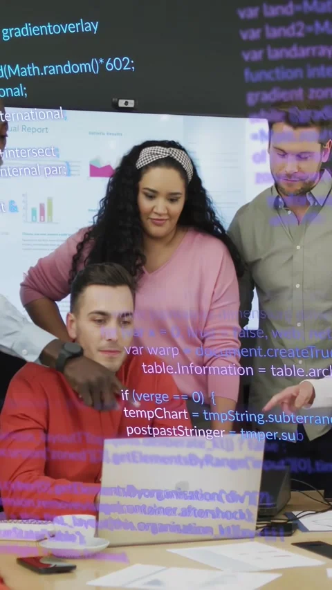 Vertical video: Seated man tapping laptop, team pointing, showing code overlay Stock Footage 334546831