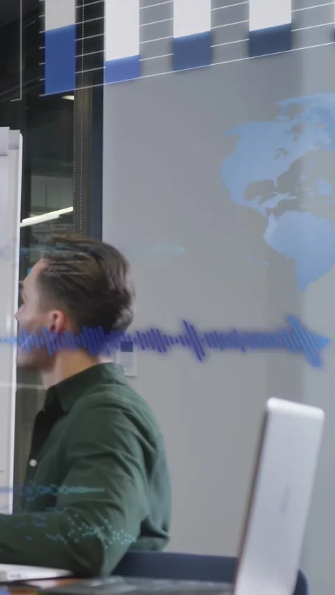 Vertical video: Seated man turning head toward glass at meeting projecting tech Stock Footage 334600430