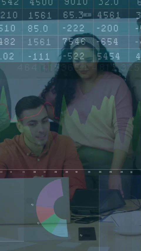 Vertical video: Seated man using laptop, standing woman reviewing data, causing Stock Footage 330242589