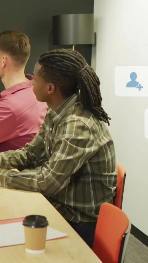 Vertical video: Seated man watching, new notification icons accumulating over Stock Footage 331721425