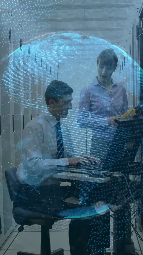 Vertical video: Seated tech typing tests in rack, tech pointing ports, blue orb Video stock 332806542