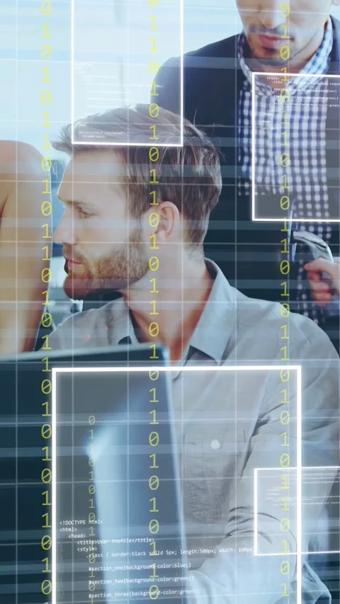 Vertical video: Seated tech typing while peer approaching with handheld, moving Stock Footage 335264263