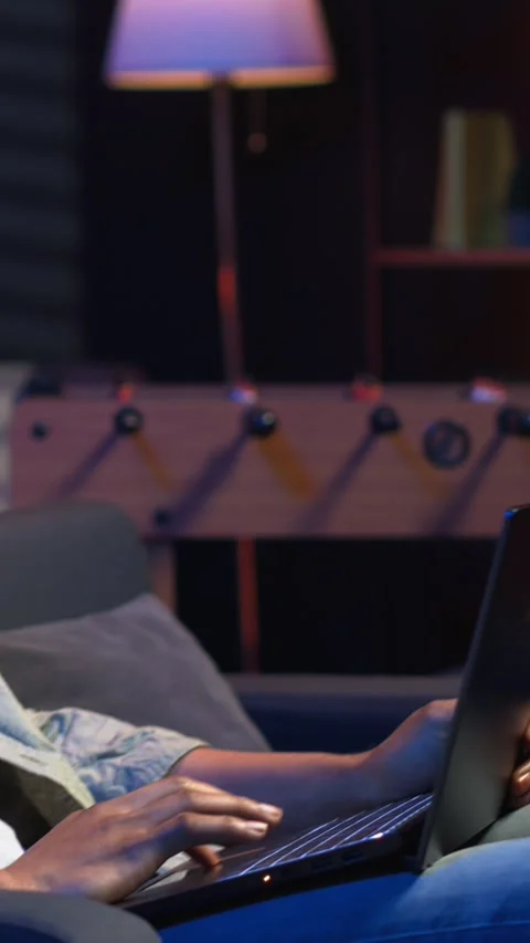 Vertical Video Self employed guy browsing the web and listening to music Stock Footage 308201900