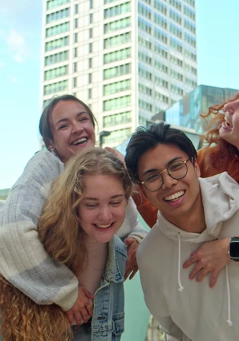 Vertical video. Selfie portrait of a group of young people having a good time. Stock Footage 247491069