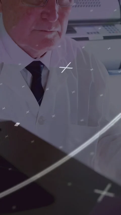 Vertical video: Senior doctor typing keys, sending lines sweeping, lifting Stock Footage 334386161