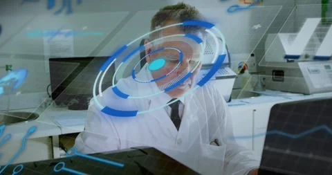Vertical video: Senior lab tech tracking blue overlay appearing, leaning, using Stock Footage 331165662