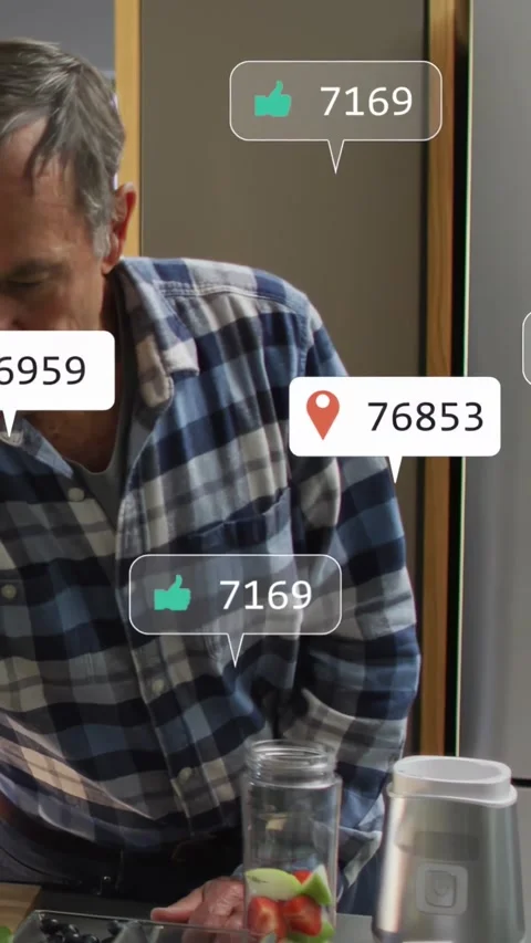 Vertical video: Senior man making fruit jar for social media, icons animating Stock Footage 332734479