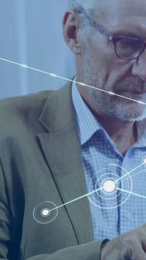 Vertical video: Senior man tapping tablet creating node web overlaying chest and Vidéo 334598937