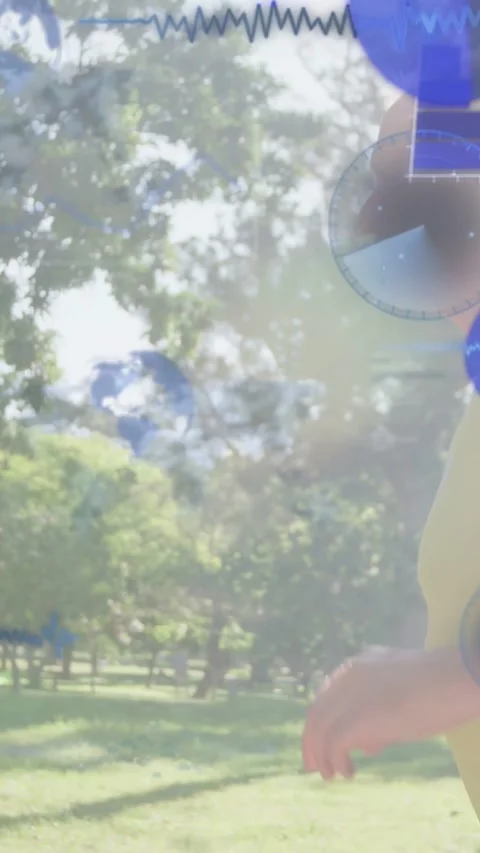 Vertical video: Senior man walking park while tech gauges fading in over torso Stock Footage 334025583