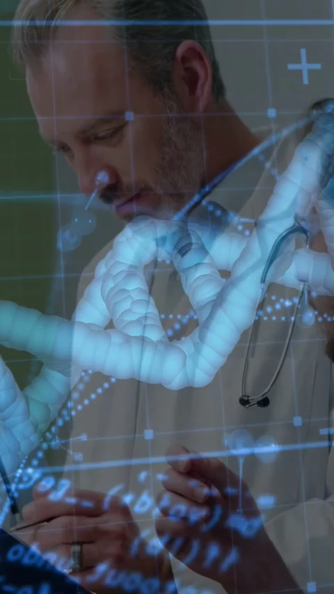 Vertical video: Senior MD tapping tablet, guiding trainee while DNA helix and Stock Footage 340133409