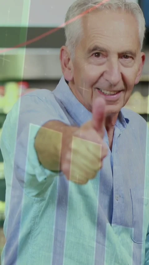 Vertical video: Senior raising hand giving thumbs endorsing savings with data Stock Footage 333036493