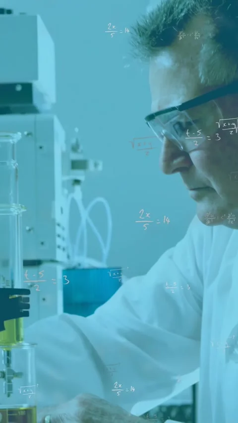 Vertical video: Senior scientist lowering clamp and metering yellow flow for Stock Footage 330395958