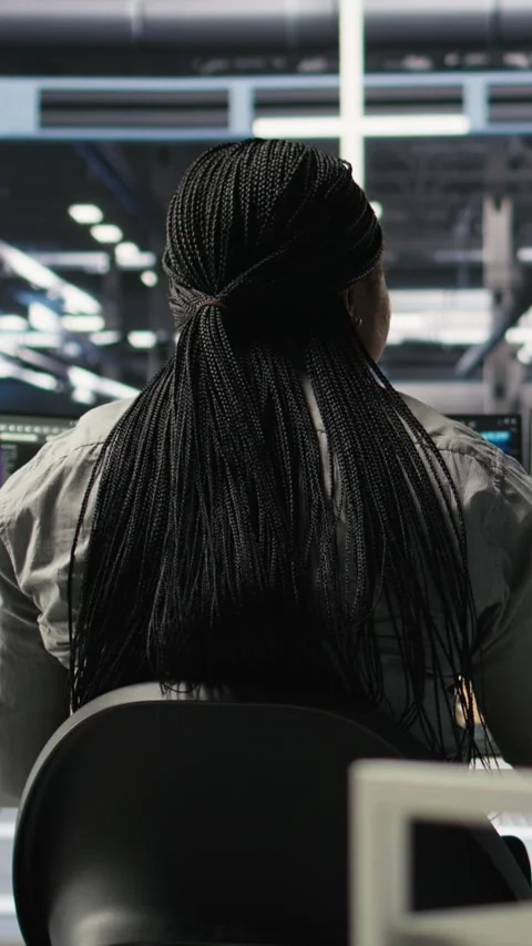 Vertical video Server farm IT specialist using PC to apply artificial Stock Footage 307970592