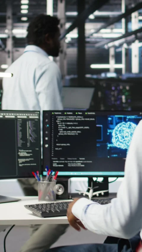 Vertical video Server hub engineering team interprets AI generated data Stock Footage 308755497