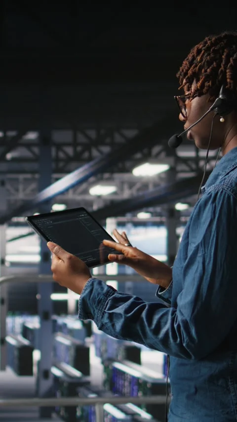 Vertical video Server hub IT expert monitors systems, doing tech support Stock Footage 310779650