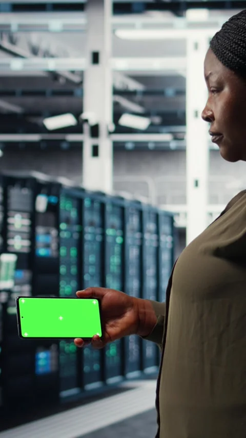 Vertical video Server hub software developer uses green screen smartphone Stock Footage 317054810