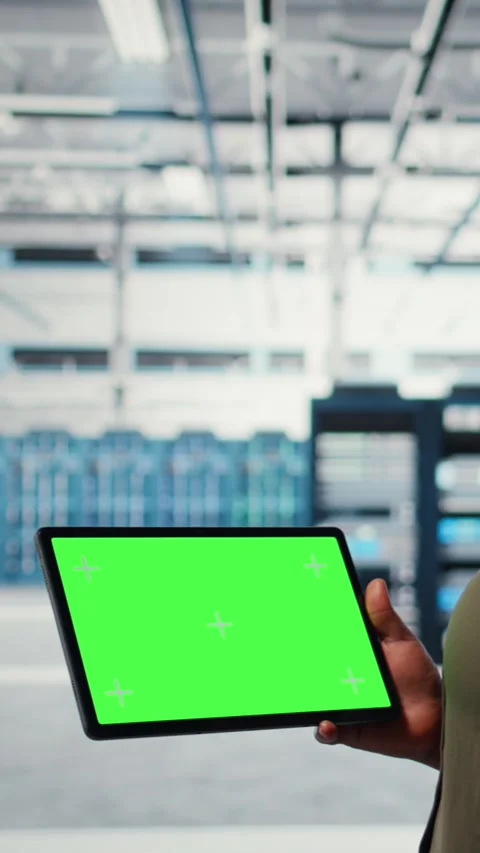 Vertical video Server room admin uses isolated screen tablet to increase Stock Footage 316856554