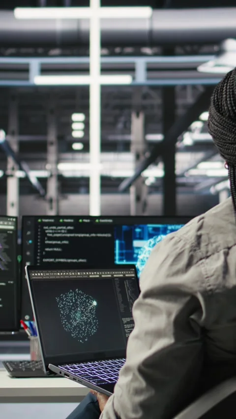 Vertical video Server room IT expert using laptop to apply artificial Stock Footage 307970553