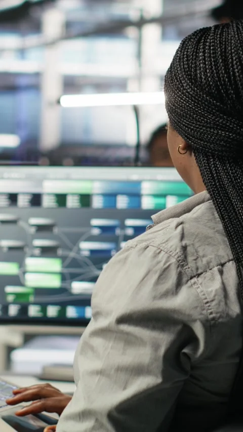 Vertical video Server room IT expert using laptop to apply artificial Stock Footage 308755709