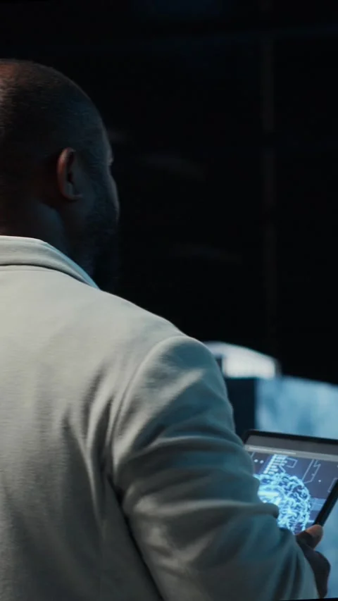 Vertical video Server room software developer troubleshooting errors using Stock Footage 311489358