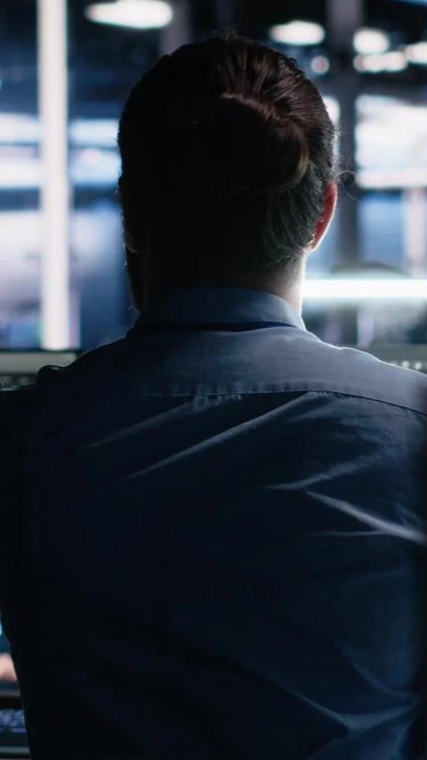 Vertical video Server room software developer using AI to review infrastructure Stock Footage 313455712