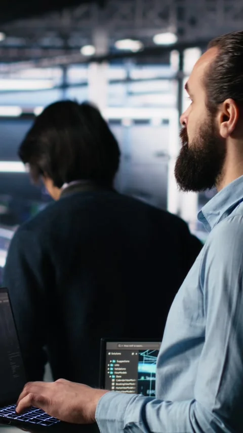 Vertical video Server room technician using AI LLM chatbot to review Stock Footage 313455964