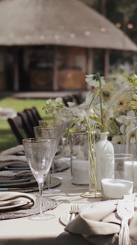 Vertical video. Serving the dining table, wedding table outdoors. Close-up of Stock Footage 308636841