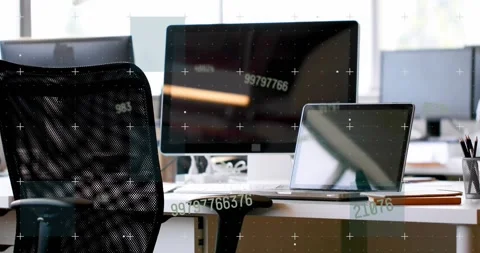Vertical video: Shifting camera showing monitor and laptop at desk revealing Stock Footage 331820257