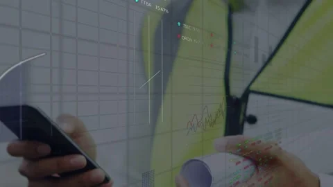 Vertical video: Shifting focus worker tapping phone on site with plans viewing Stock Footage 333318264