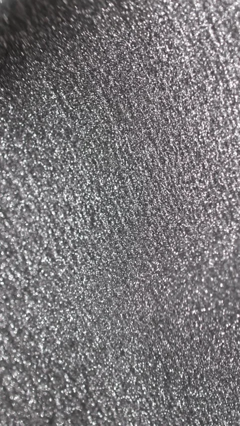Vertical video of shimmering silver paint texture moving slowly with gentle Stock Footage 327604770