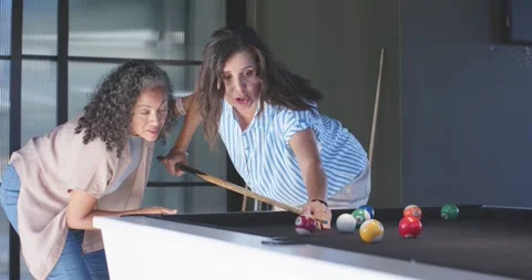 Vertical video: Shooter drawing cue back and striking cue ball on pool table, Stock-Footage 342721515