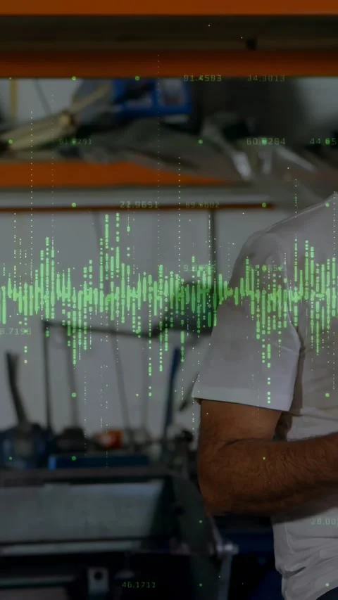 Vertical video: Shop tech walking in, tapping phone, checking machine data under Stock Footage 330359359