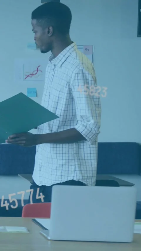 Vertical video: Showing man in plaid holding green folder in office, walking Stock Footage 331166966