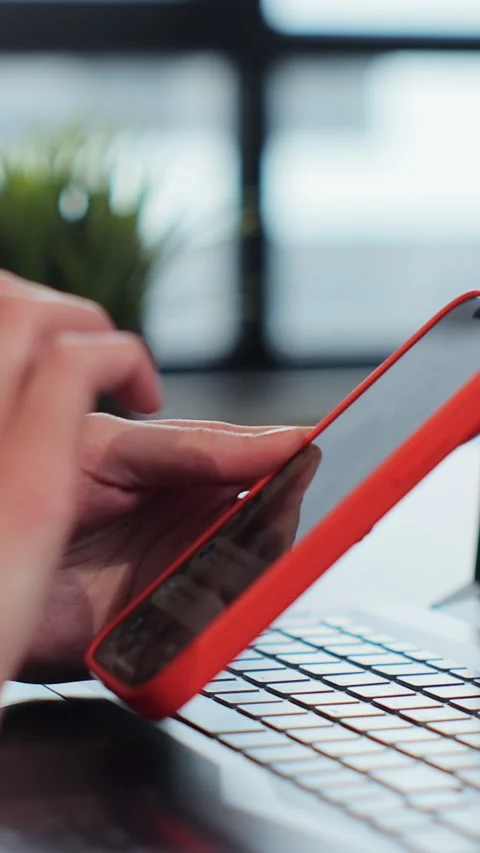 Vertical video. Side view. Hand of young girl using texting mobile phone or chat Stock Footage 347782778