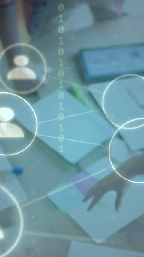 Vertical video: Single icon fading in, team moving notes and using tablet, Stock Footage 334770673