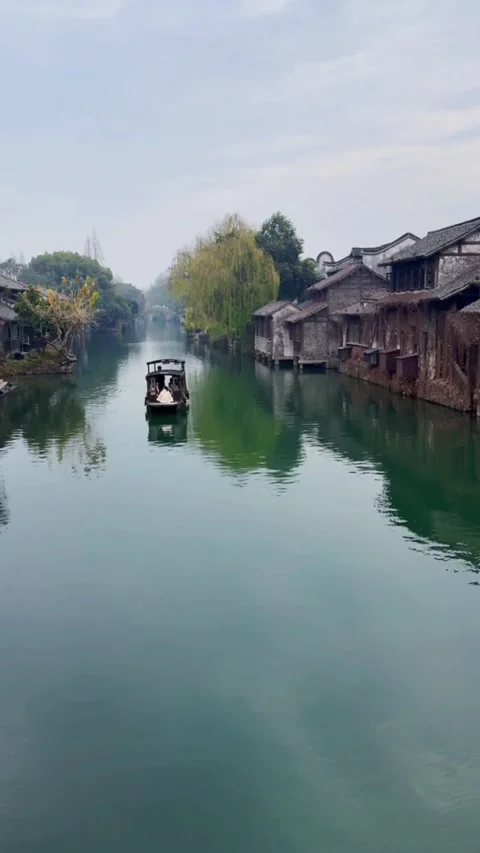 Vertical Video Single Traditional Boat Sailing on Misty River in Wuzhen Wate Stock Footage 326849853