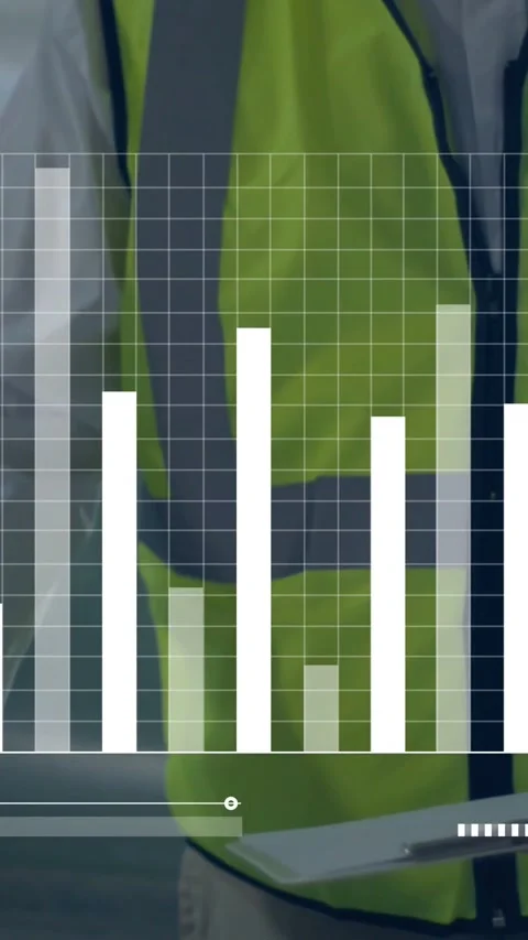 Vertical video: Site lead leaning over table checking tablet as dashboard bars Stock Footage 334550081