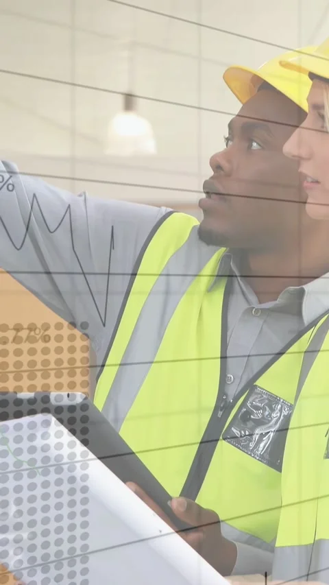 Vertical video: Site team pointing at plans and tablet for construction overlays Stock Footage 334770585