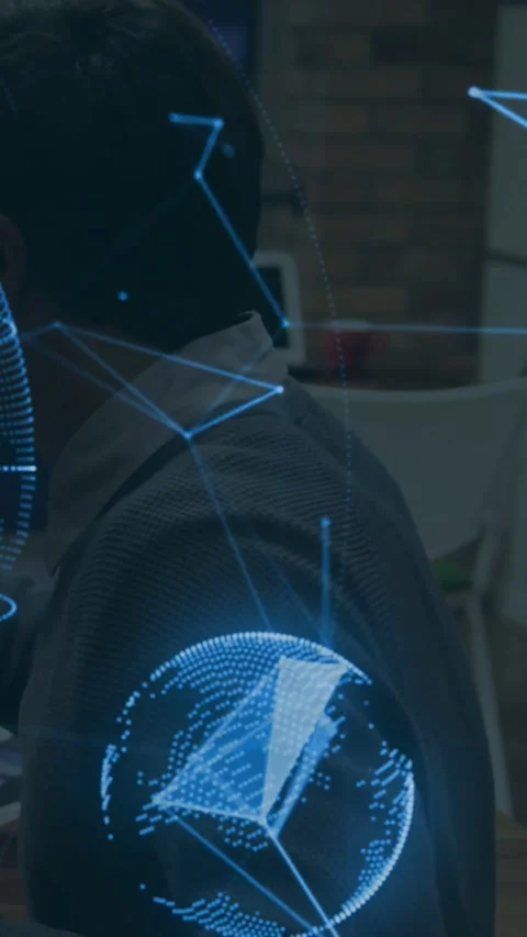Vertical video: Sitting man, holo rising near him, spinning globe forming mesh, Stock Footage 331215918