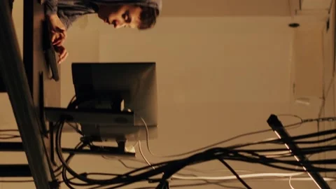 Vertical video: Skilled spy committing cybercrime on computer firewall Video stock 228659816