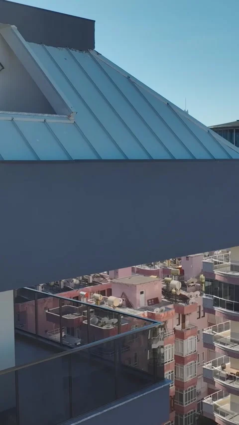 Vertical Video: Sleek and modern real estate with sparkling glass facades stands Stock Footage 297632509
