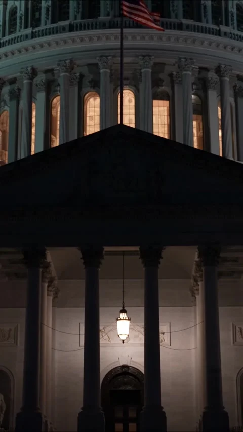 Vertical video slow motion closeup camera tilting up revealing US Capitol dome Stock Footage 314658323