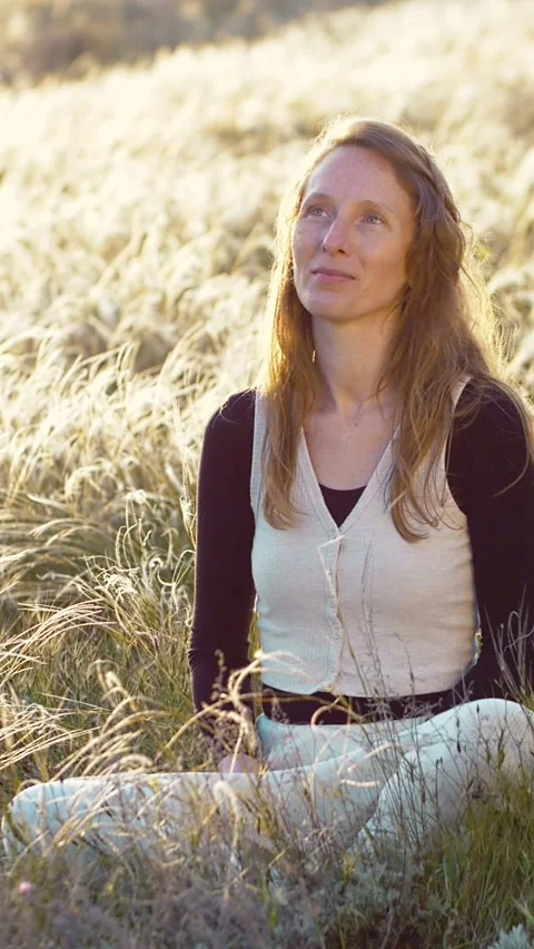 Vertical video Slow motion. Portrait A woman rests and smiles sitting on a Video stock 241650479