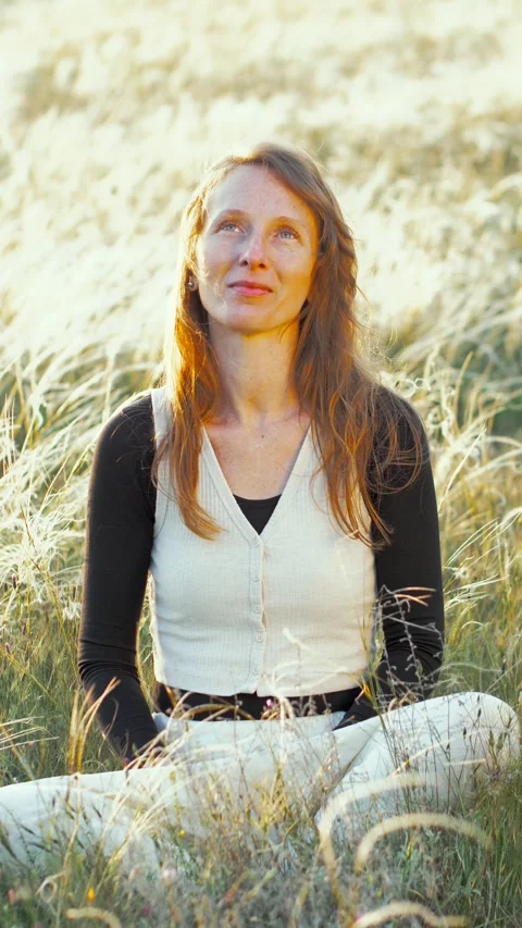 Vertical video Slow motion. Portrait A woman rests and smiles sitting on a Stock Footage 241652137